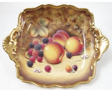 A Royal Worcester square dish, hand painted with fruit to a mossy background by J Bowman, with gilt shaped edge and intregal 