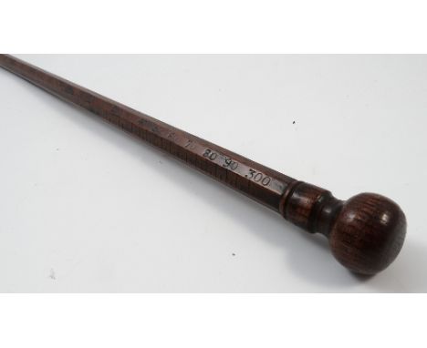 A Georgian elm customs stick, of tapering octagonal form, with knop end and brass tip, marked up to 300 and 51ins, length 53.