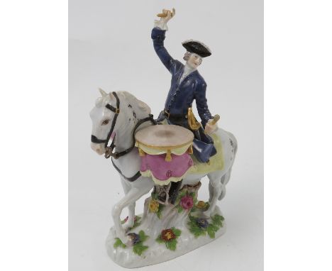 A 20th century Meissen model, of a drum horse, man seated upon a horse plating two drums, cross swords mark to base impressed