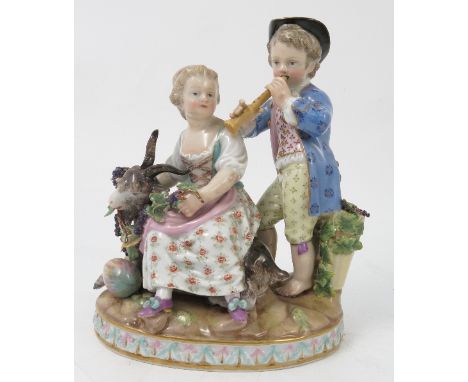 A 19th century Meissen porcelain figure group, emblematic of autumn, modelled as a male playing an instrument, with female se