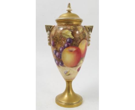 A Royal Worcester covered pedestal vase, hand painted with fruit to a mossy background by Weston, shape number H2713, height 