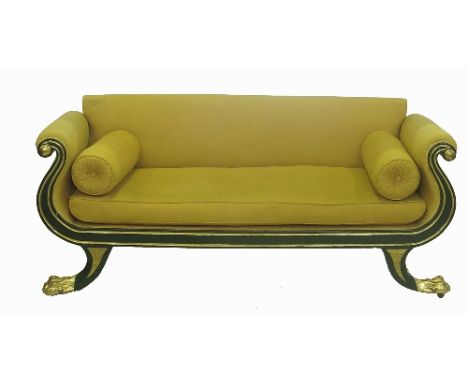 An Empire style double ended sofa, with gold upholstered seat and arms to a painted frame in green and gilt, with scrolling a