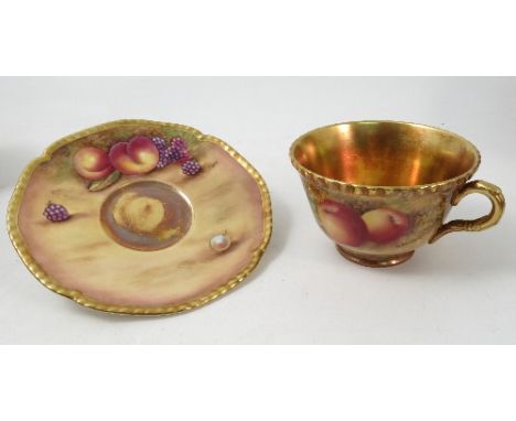A Royal Worcester cup and saucer, the exterior of the cup and the saucer hand painted with fruit to a mossy background by Bun