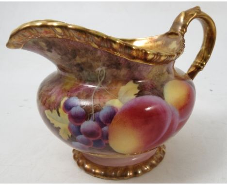 A Royal Worcester milk jug, hand painted all around with fruit to a mossy background by J Skerrett, height 3.75ins Condition 