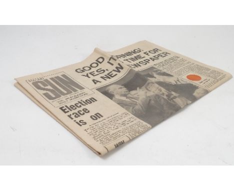 A first edition copy of The Sun newspaper