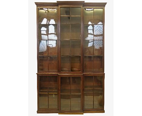 A Pepys style late Georgian design break front bookcase, the upper section comprising three doors of eight glazed panels, the