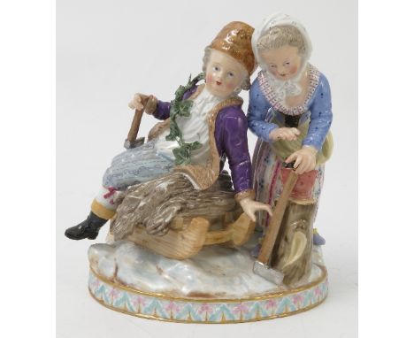 A 19th century Meissen porcelain figure group, emblematic of winter, modelled as a man seated upon a sled with sticks and an 
