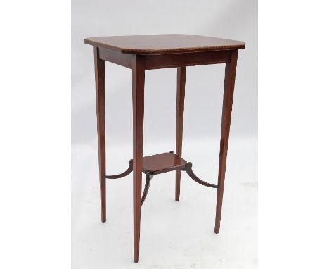 An inlaid Edwardian mahogany lamp table, the top with satinwood banding, raised on square tapering legs with undershelf