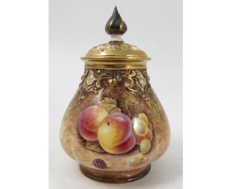 A Royal Worcester covered vase, the quarter lobbed body hand painted with fruit to a mossy background by Reed, with pierced g