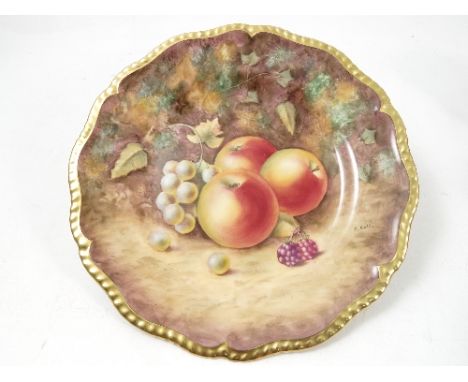 A Royal Worcester cabinet plate, hand painted with fruit to a mossy background by T Nutt, diameter 9.5ins Condition report: G