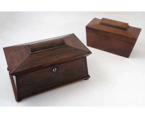 A late 19th century rosewood tea caddy, of sarcophagus form, the interior fitted with a central covered compartment with glas