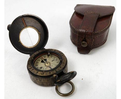 A Negretti & Zambra pocket compass, with lacquered and brass case, together with a leather travelling case