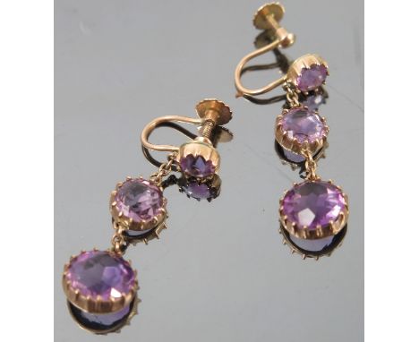 A pair of Victorian style amethyst earrings, the graduated collet set round cuts to screw fittings
 Condition report: No sign