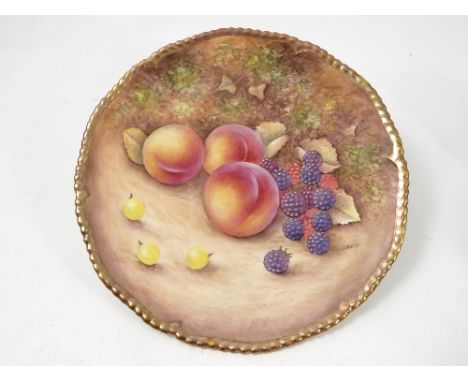 A Royal Worcester cabinet plate, hand painted with fruit to a mossy background by J Reed, diameter 7.75ins Condition report: 