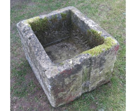 A rectangular stone pump trough 27ins x 22ins