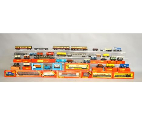 A quantity of boxed and unboxed Hornby OO Gauge rolling stock, including coaches, wagons, etc. together with a Hornby Thomas 