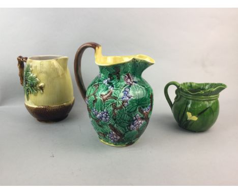 WEDGWOOD CERAMIC JUG, 19cm high, decorated with trees and fruit, along with four other ceramic jugs (5)