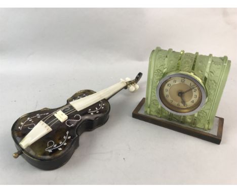 ART DECO GREEN GLASS MANTEL CLOCK, 11cm high, along with a miniature cello ornament