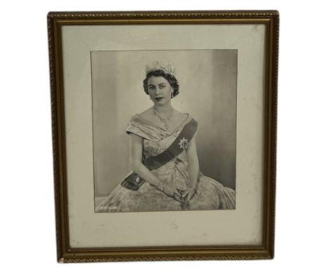 A DOROTHY WILDING PORTRAIT OF QUEEN ELIZABETH TAKEN IN 1952 TO COMMEMORATE HER CORONATION45cms x 37cmsFramed and glazed