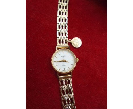 A Rotary quartz ladies watch with gold 375 gate bracelet with a small 9ct St Christopher pendant attached, Boxed 14.3g gross