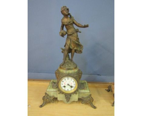 A French clock 'La Rosee Du Matin par aug. Moreau' inscripted, brass figure and designs with a marble base. 21" high signed a