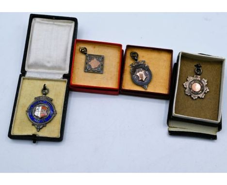 3 Silver Football Fob Medals and one silver and enamel medal - 3 of which are relating to the March Charity Cup and dated 192