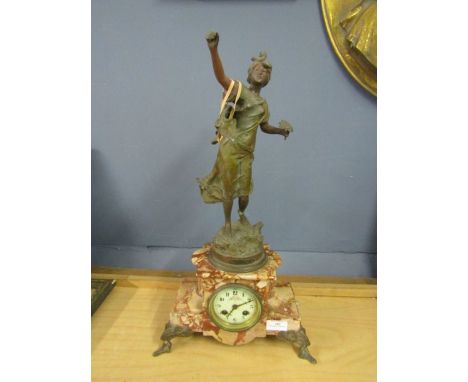 A French clock 'Hahmonie des Champs- par Rousseau' brass figure on a marble base, signed at base 22" high. broken at the back