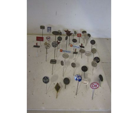Vintage motoring related pin badge collection - around 40 to include Esso, Caltex, Fina, Shell, Pam, Polygas, Oldsmobile etc
