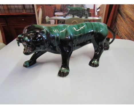 Large ceramic Art Deco style Lion figure with missing tooth. Length 60cm approx