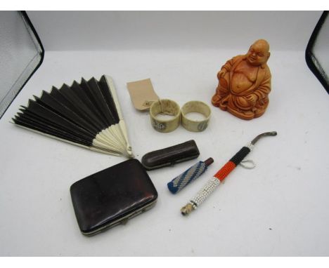 collectors lot to include a Buddah, cigarette case, crute holder, 2 bone napkin rings