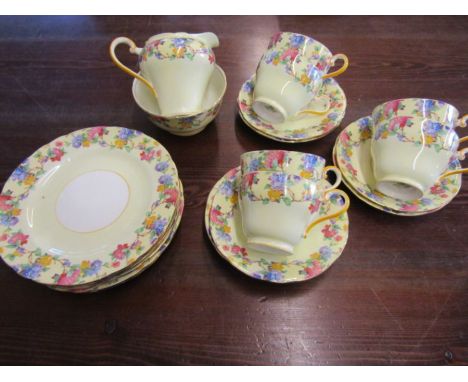 Aynsley part tea set, yellow with floral design comprising 6 cups, saucers, 6 plates, sugar bowl and milk jug