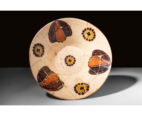 Ca. AD 900 - 1000. A Nishapur white bowl with black hand-painted vegetal and iconic trilobate symbols in rich black, yellow, 