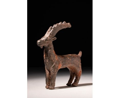 Ca. 1200 - 800 BC. A Western Asiatic cast-bronze stag with long horns. The animal has a slender, elongated body and strong hi