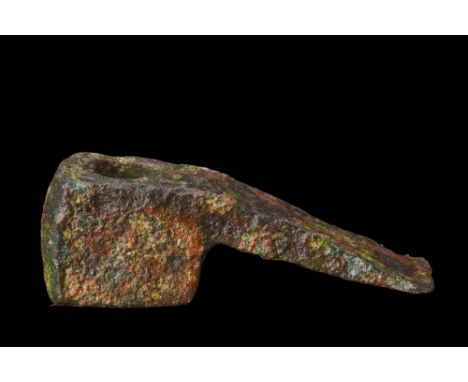 Ca. 1200-900 BC.A Bronze Age bronze adze. An adze is a cutting tool similar to an axe but with the cutting edge perpendicular