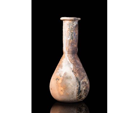 Ca. AD 100 - 200. A Roman glass unguentarum with amazing brown iridescence. It features a slightly flat base, pear-shaped bod