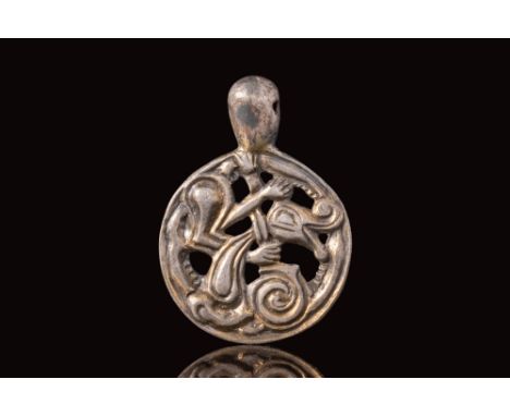 Ca. AD 900 - 1100.An Viking open work pendant of a discoid form, made from silver gilt. The circular form features gilt open 