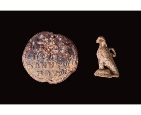 Ca. AD 100 - 500. A group of ancient artifacts comprised of a lead byzantine seal with an inscription and a Roman bronze legi
