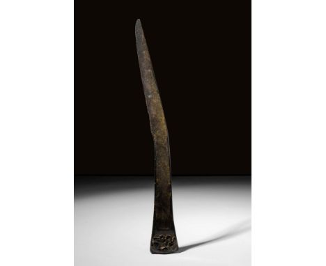 Ca. 700 - 500 BC. An Early Scythian bronze curved dagger with superb hammering and lovely grooves as decoration. Primarily a 