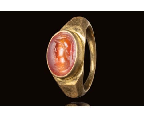 Ca. AD 100 - 300.A Roman oval shaped carnelian intaglio depicting the bust of Minerva depicted wearing a Corinthian helmet. T