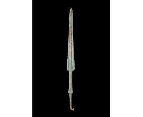 Ca. 1200 - 700 BC.A bronze Bronze Age spearhead with a distinctive slender leaf-shaped blade with prominent central rib. This