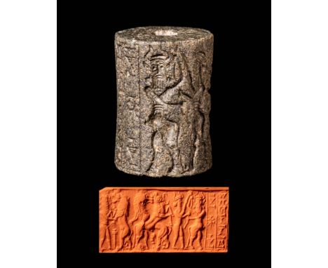 Ca. 2350 - 2150 BC or later.An Akkad III cylinder seal depicting a battle scene with a curly haired hero. Surrounding this, t