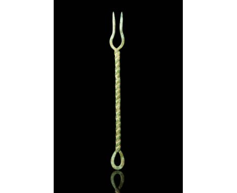Ca. AD 300. A Roman bronze fork with curved tines connected to a twisted handle with a twisted oval openwork finial. Size: 15