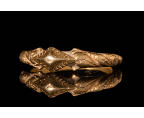 Ca. AD 1400 - 1600. A Javanese gold ring with a round hoop and a twisted section. The bezel is decorated with the moon. For s