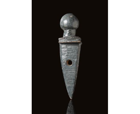 Ca. AD 100 - 300. A Roman Legionary pendant shaped as gladius with a double edge blade tapering to the point. It has a double