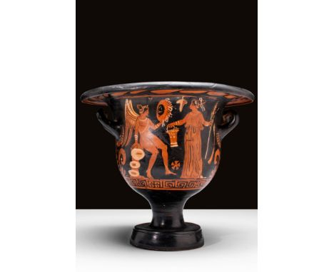 Ca. 350 - 300 BC. A rare red-figure pottery bell krater with a large body and two handles. The krater features traditional pa