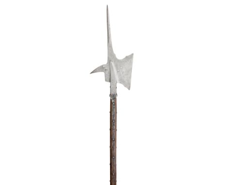 **A HALBERD, POSSIBLY GERMAN MID-16TH CENTURY with robust central spike flattening to a rectangular shape at its base, tall a