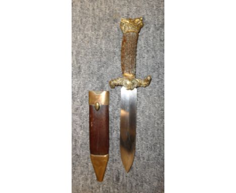 A HUNTING KNIFE, LATE 19TH CENTURY with broad double-edged blade, brass hilt cast with neo-rococo designs, comprising cross-p