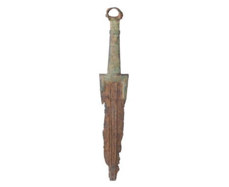 A NORTH-WEST PERSIAN BRONZE AND IRON DAGGER, LURISTAN, 1000 B.C. in excavated condition, with iron blade (incomplete) formed 