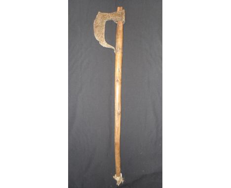 A EUROPEAN AXE, 18TH/19TH CENTURY in excavated condition, with tall beard fixed to the haft at the base, pierced oval socket,
