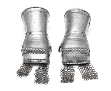 **A PAIR OF SOUTH GERMAN MITTEN GAUNTLETS, CIRCA 1530-40 each formed of a moderately long slightly flaring straight-ended cuf